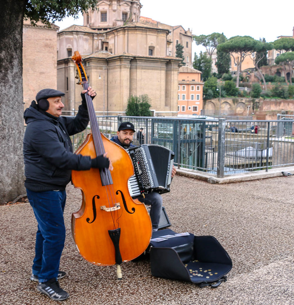 Street performance in front of Roman Forum, roadsanddestinations.com